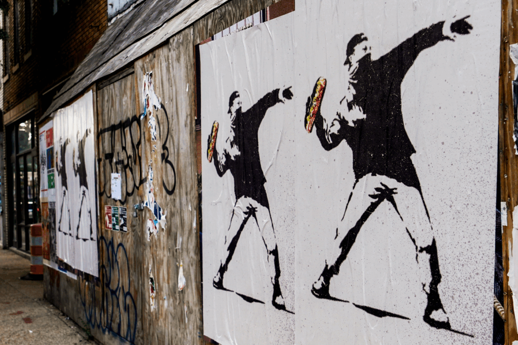 Posters of a man throwing a sandwich