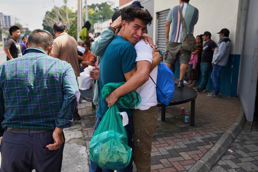 Guatemalan migrant hugging relative